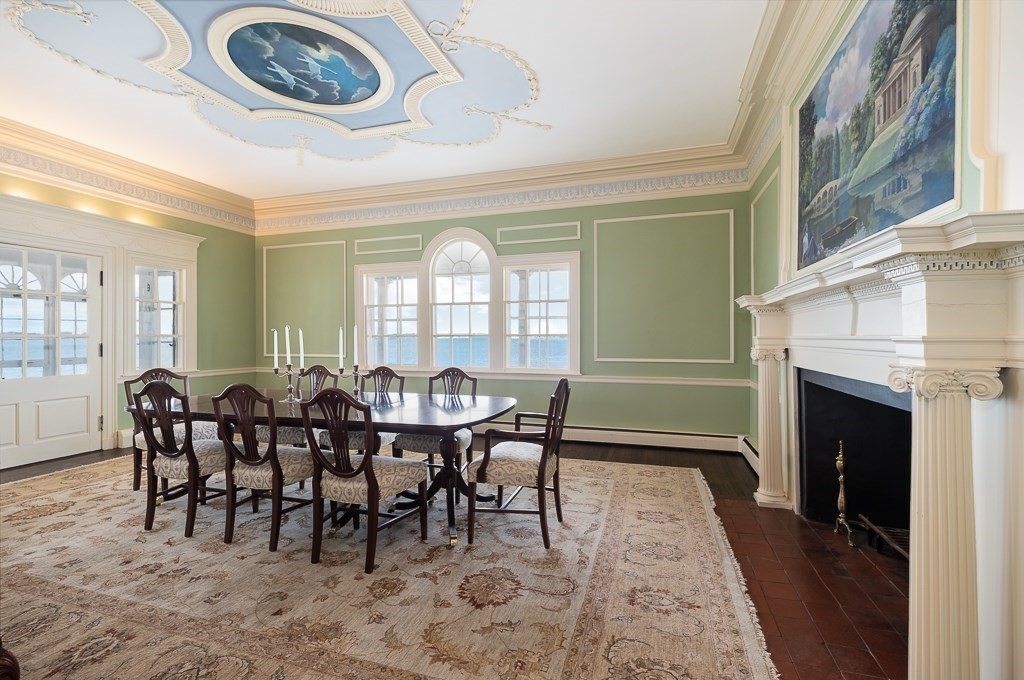 66 Ocean Street Nahant, MA 01908 - Photo 9 of 40 a dining room with furniture a floor to ceiling window and a fireplace