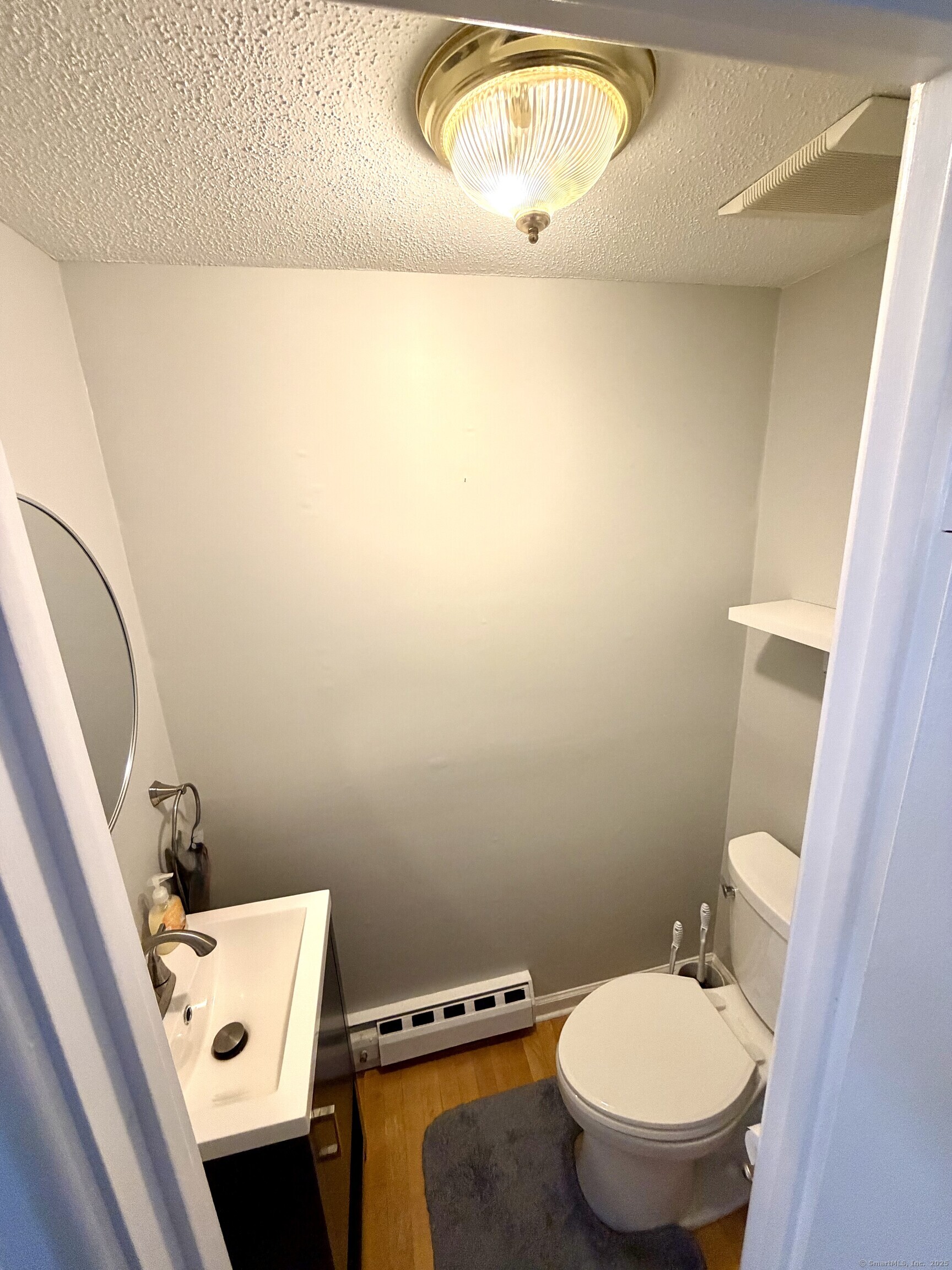 38 Surrey Lane, Unit 38 Torrington, CT 06790 - Photo 12 of 24 a bathroom with a toilet and a sink