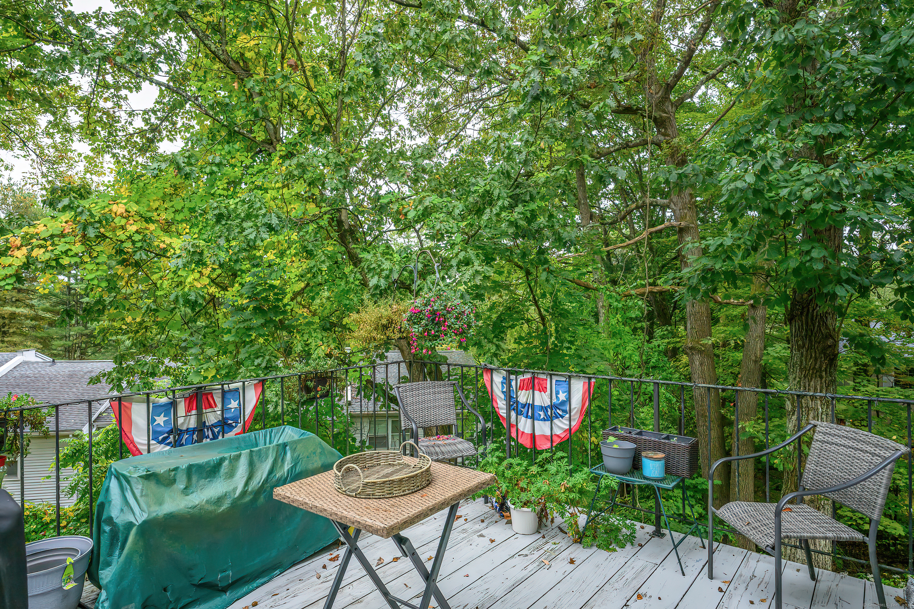 38 Surrey Lane, Unit 38 Torrington, CT 06790 - Photo 14 of 24 a view of a chairs and table in a patio
