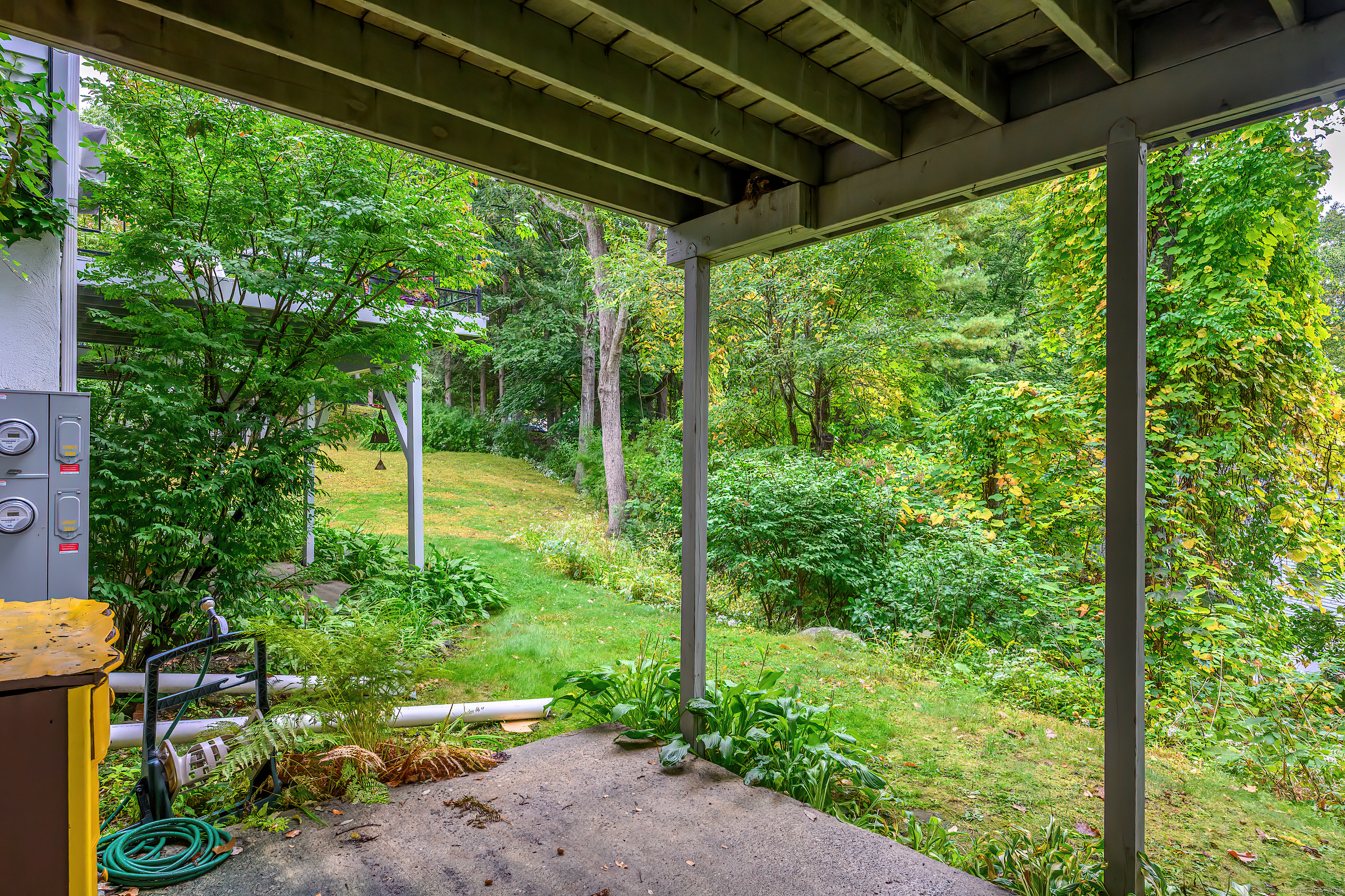 38 Surrey Lane, Unit 38 Torrington, CT 06790 - Photo 18 of 24 a view of a backyard with garden