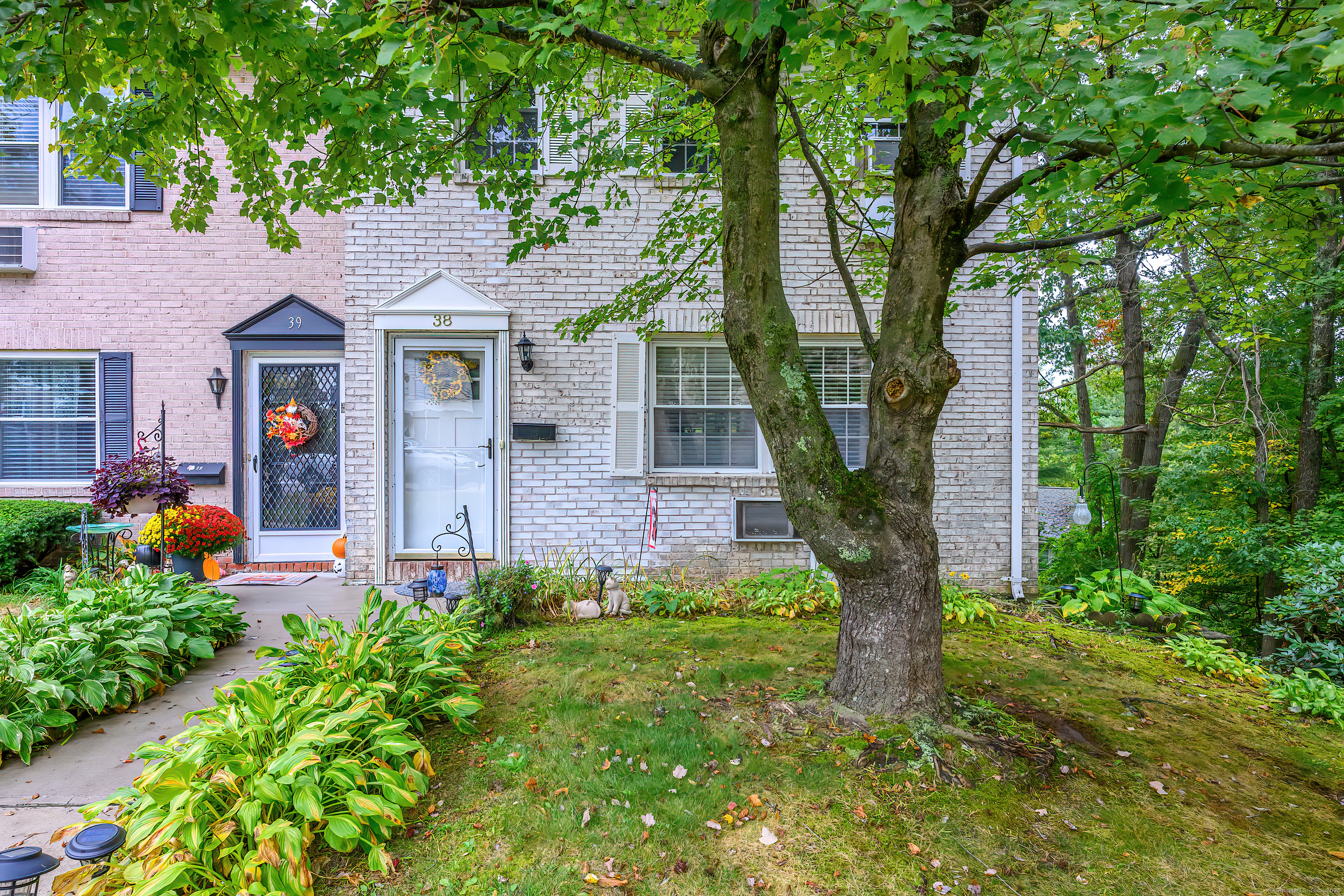 38 Surrey Lane, Unit 38 Torrington, CT 06790 - Photo 22 of 24 a front view of a house with garden