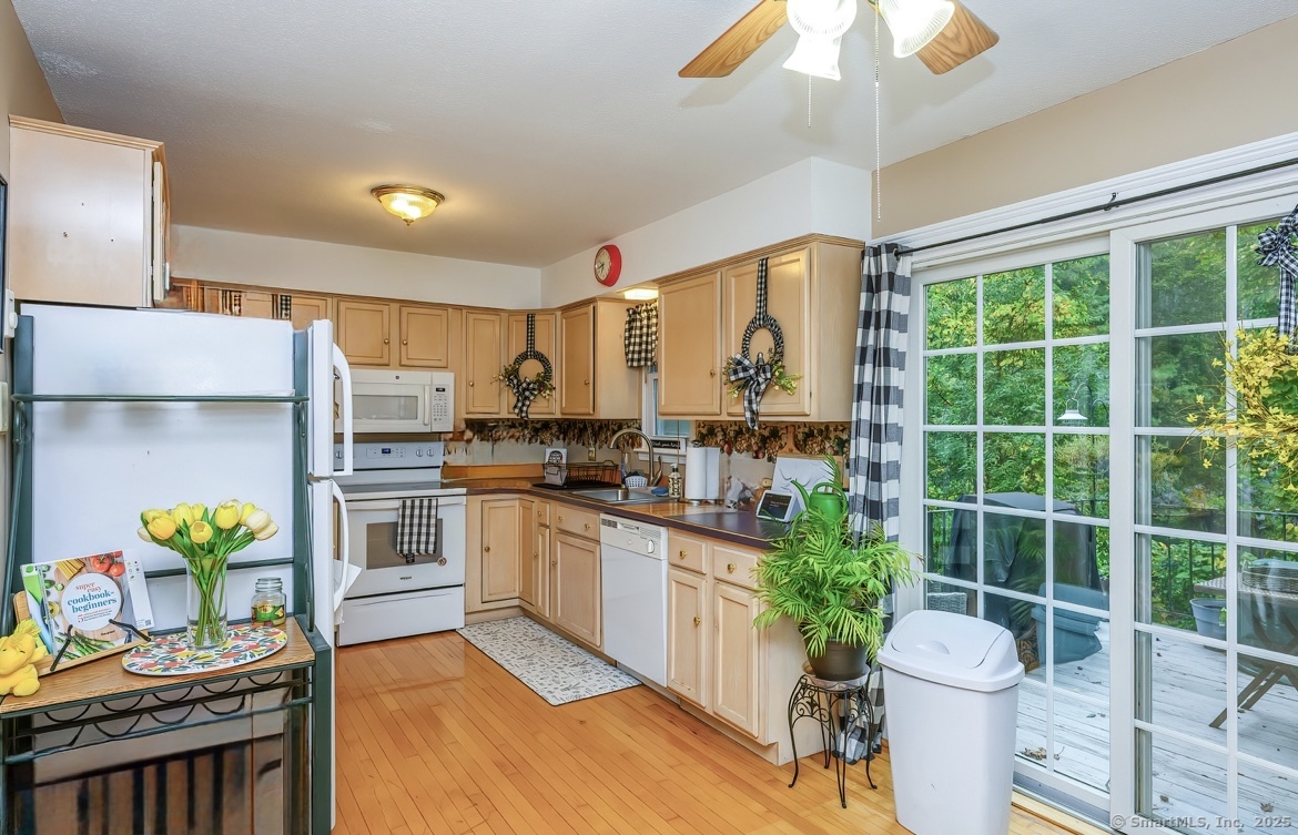 38 Surrey Lane, Unit 38 Torrington, CT 06790 - Photo 5 of 24 a kitchen with stainless steel appliances a sink a stove and a refrigerator