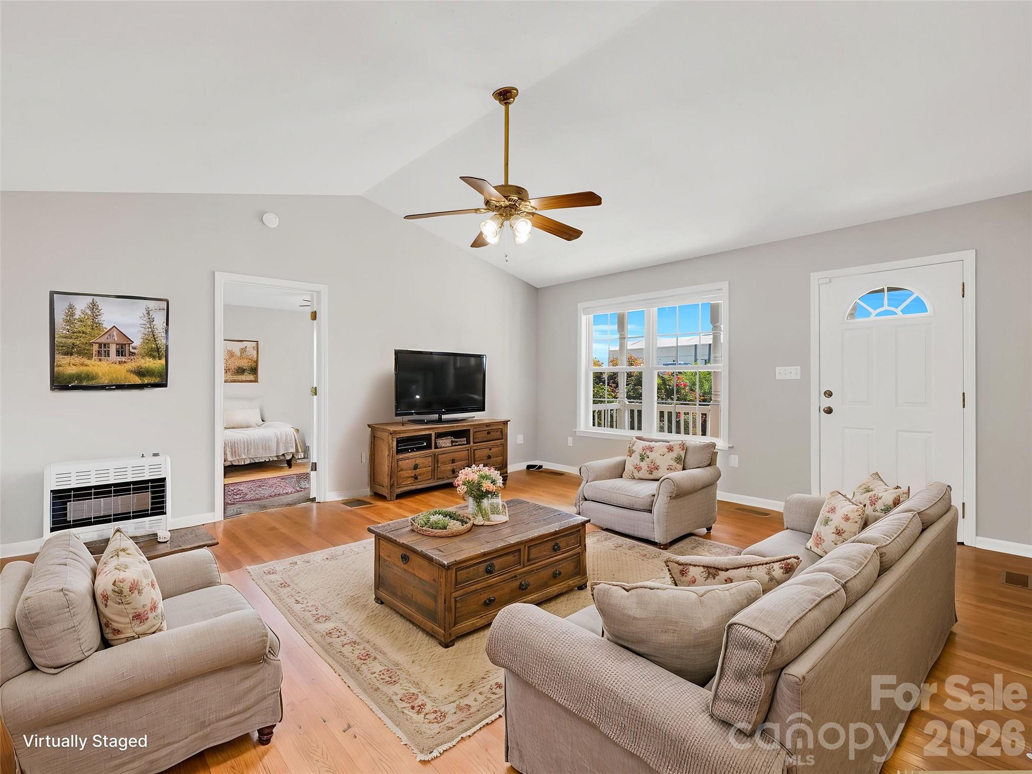 1249 Melvin Hill Road Campobello, SC 29322 - Photo 11 of 41 a living room with furniture a flat screen tv and a window