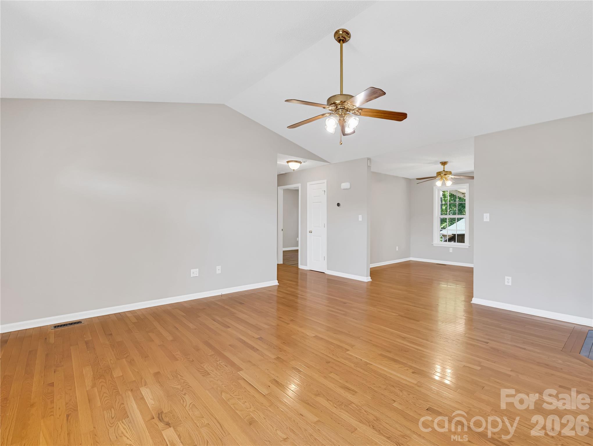 1249 Melvin Hill Road Campobello, SC 29322 - Photo 12 of 41 a view of an empty room with window and wooden floor