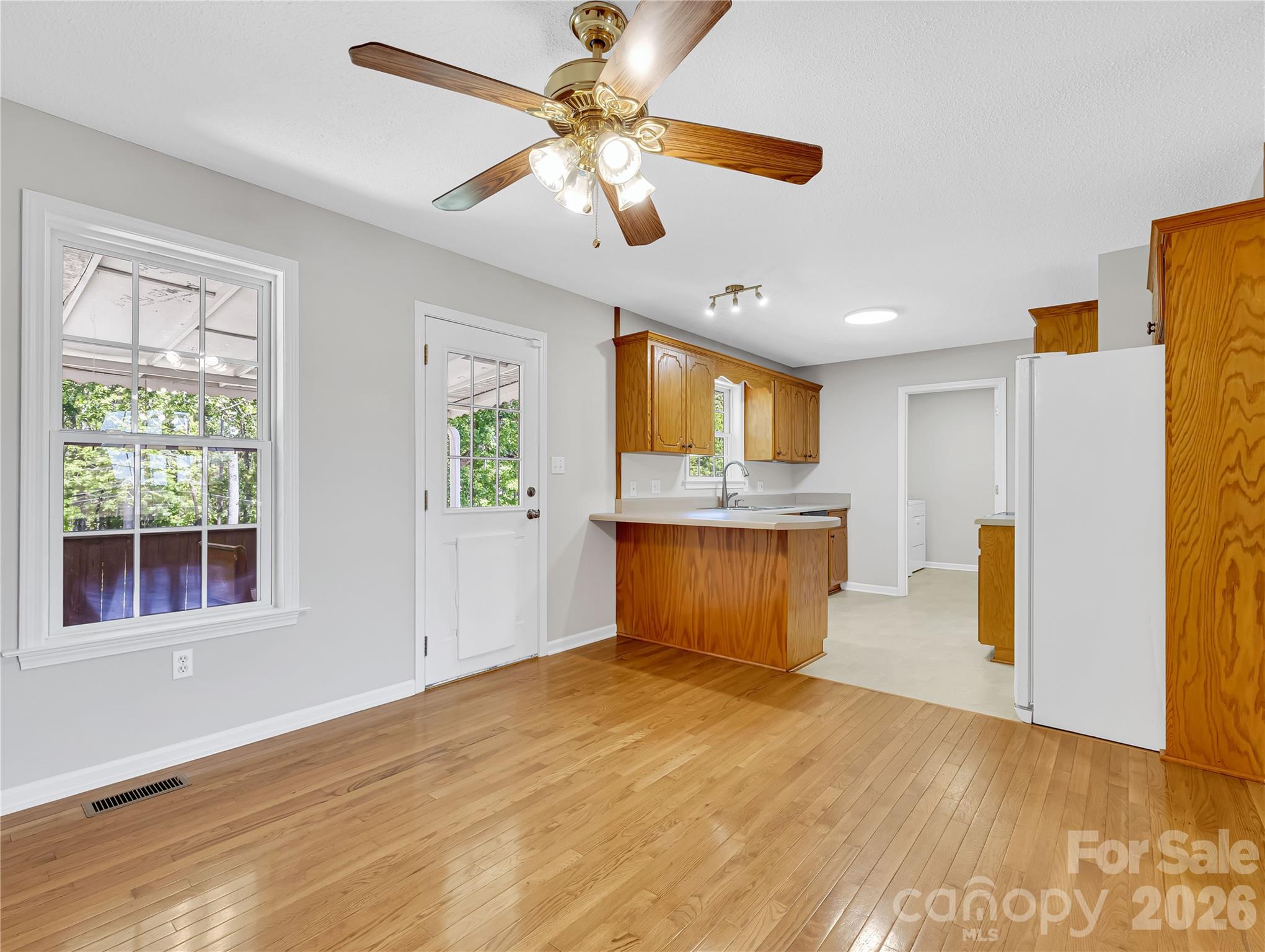 1249 Melvin Hill Road Campobello, SC 29322 - Photo 15 of 41 a view of kitchen with kitchen island wooden floor appliances and cabinets