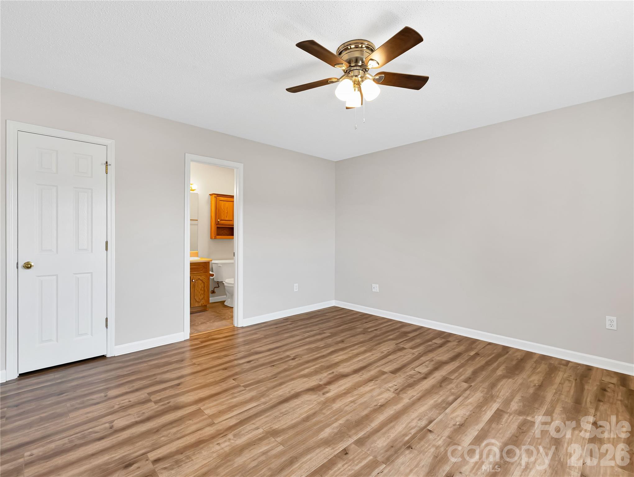 1249 Melvin Hill Road Campobello, SC 29322 - Photo 18 of 41 an empty room with wooden floor and windows