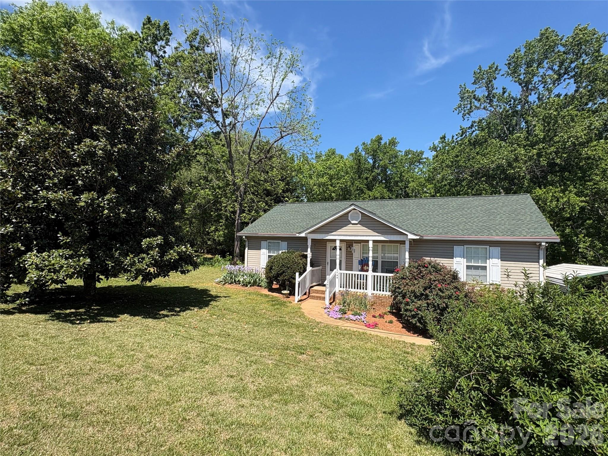 1249 Melvin Hill Road Campobello, SC 29322 - Photo 2 of 41 a front view of a house with a yard and trees
