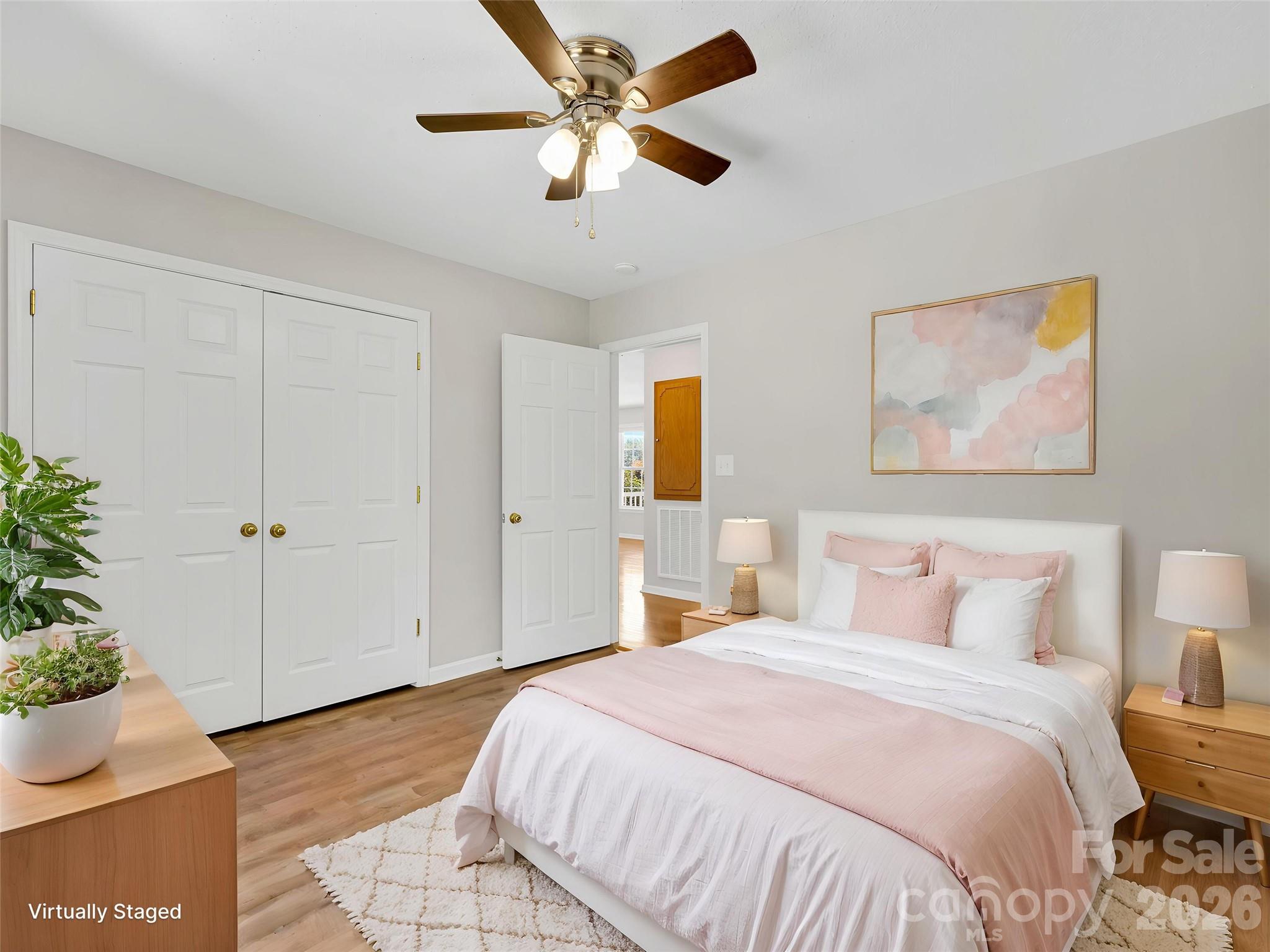 1249 Melvin Hill Road Campobello, SC 29322 - Photo 23 of 41 a bedroom with a bed and a potted plant