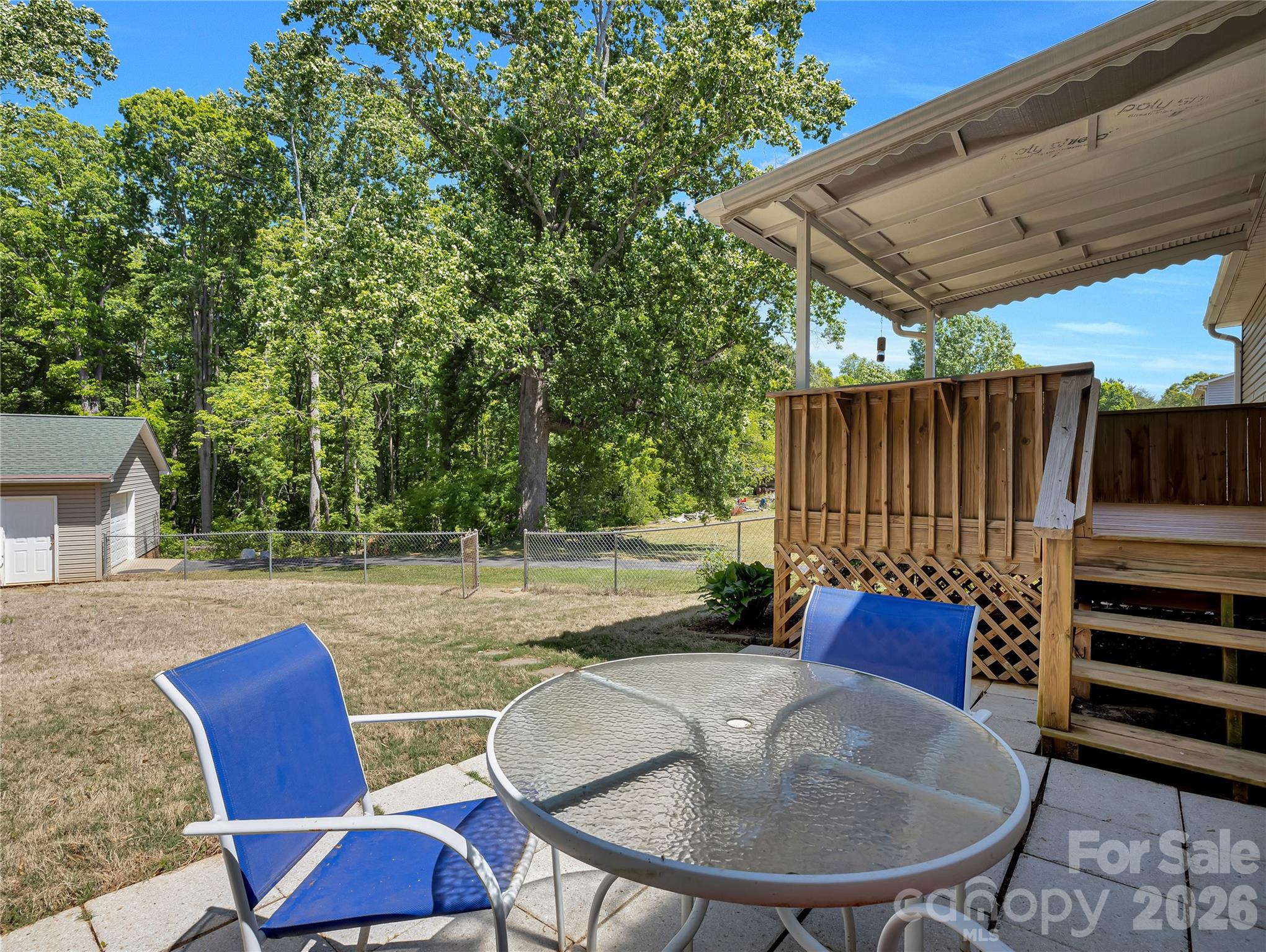 1249 Melvin Hill Road Campobello, SC 29322 - Photo 29 of 41 a backyard of a house with table and chairs