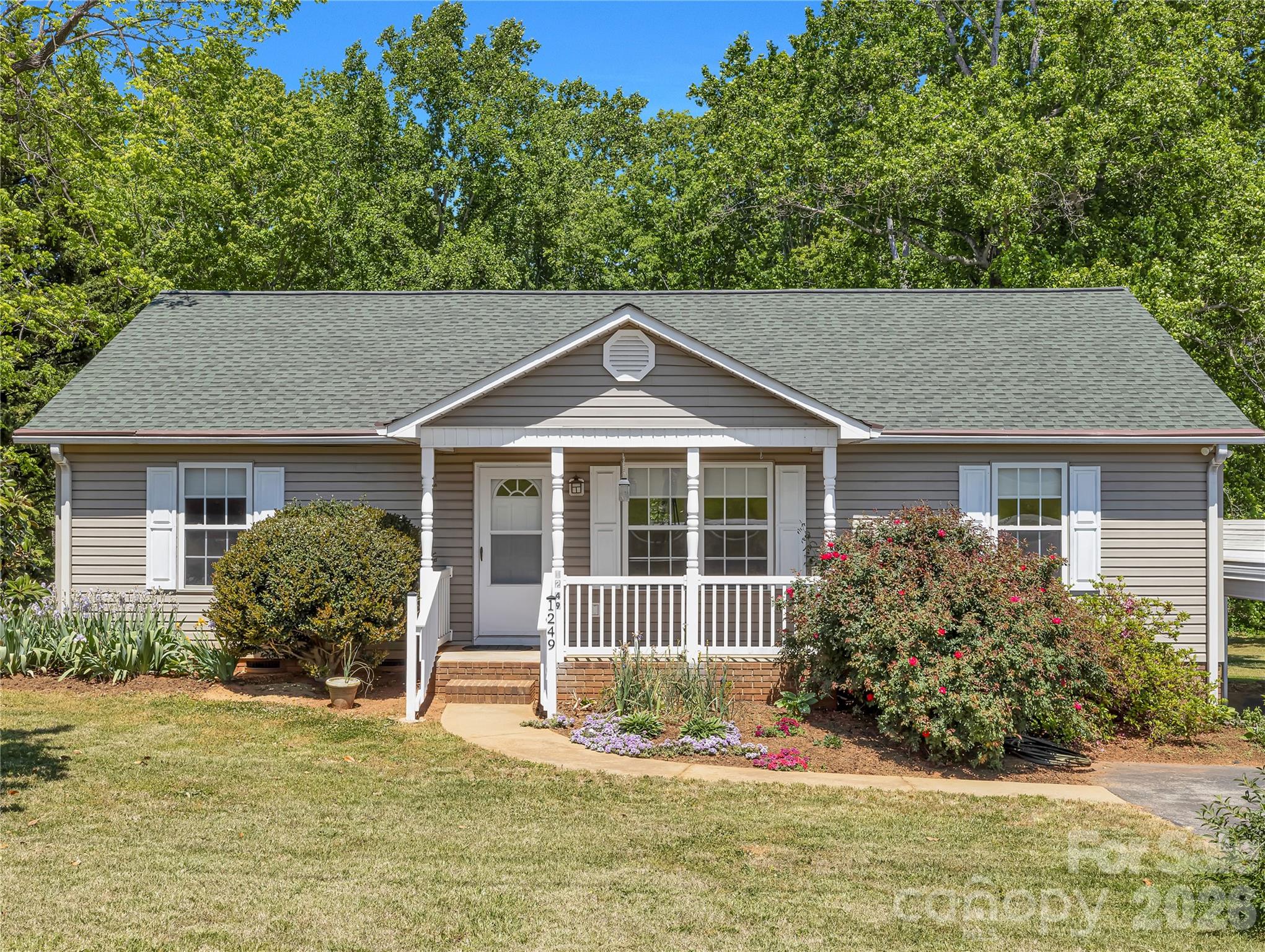 1249 Melvin Hill Road Campobello, SC 29322 - Photo 4 of 41 a front view of a house with a yard