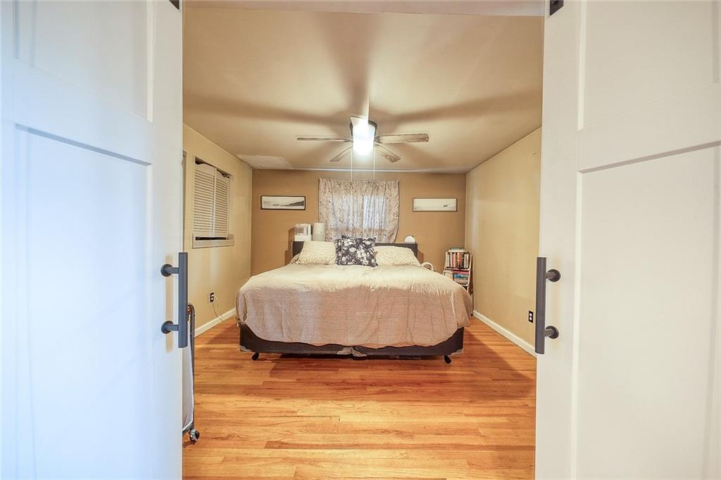 685 Blue Ridge Road Pittsburgh, PA 15239 - Photo 13 of 32 The large master bedroom is large and has hardwood flooring.