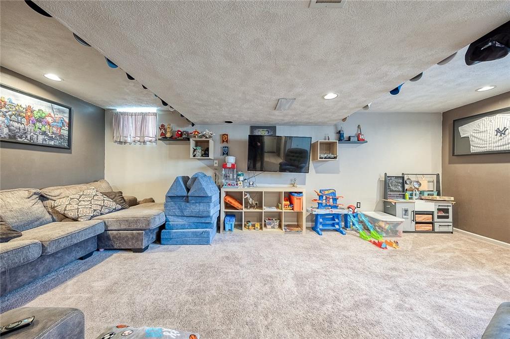 685 Blue Ridge Road Pittsburgh, PA 15239 - Photo 23 of 32 The expansive lower level family room measures 22 by 19 feet.