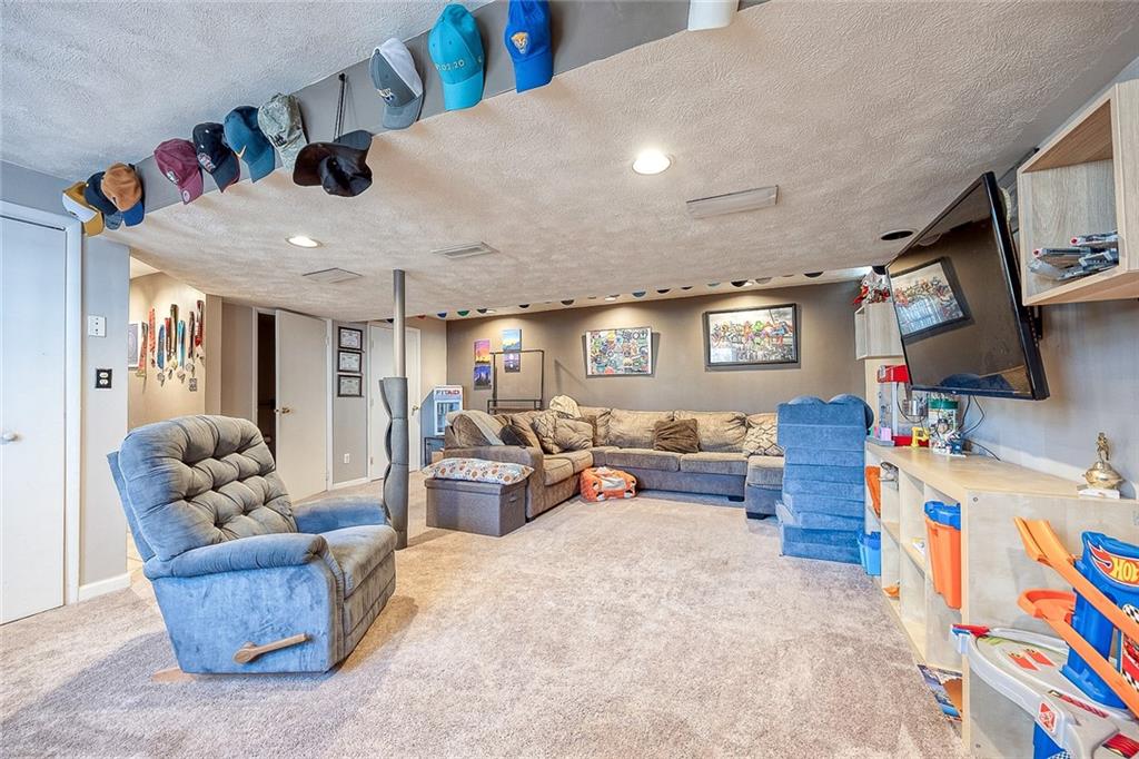 685 Blue Ridge Road Pittsburgh, PA 15239 - Photo 25 of 32 The lower level family room is sizeable and has newer carpeting.
