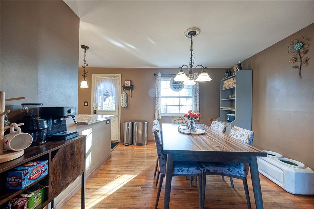685 Blue Ridge Road Pittsburgh, PA 15239 - Photo 6 of 32 The dining room has hardwood flooring and opens to the kitchen.