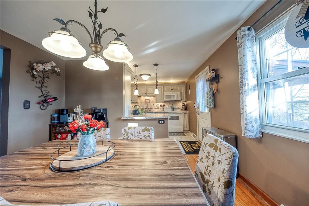 685 Blue Ridge Road Pittsburgh, PA 15239 - Photo 8 of 32 The dining room flows into the kitchen separated by a peninsula that can be used for food prep.