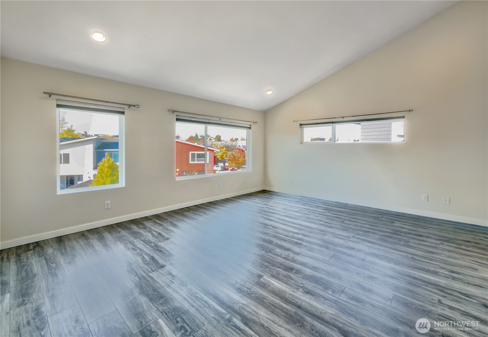 9849 6th Place Southwest Seattle, WA 98106 - Photo 14 of 21 a view of an empty room with wooden floor and a window