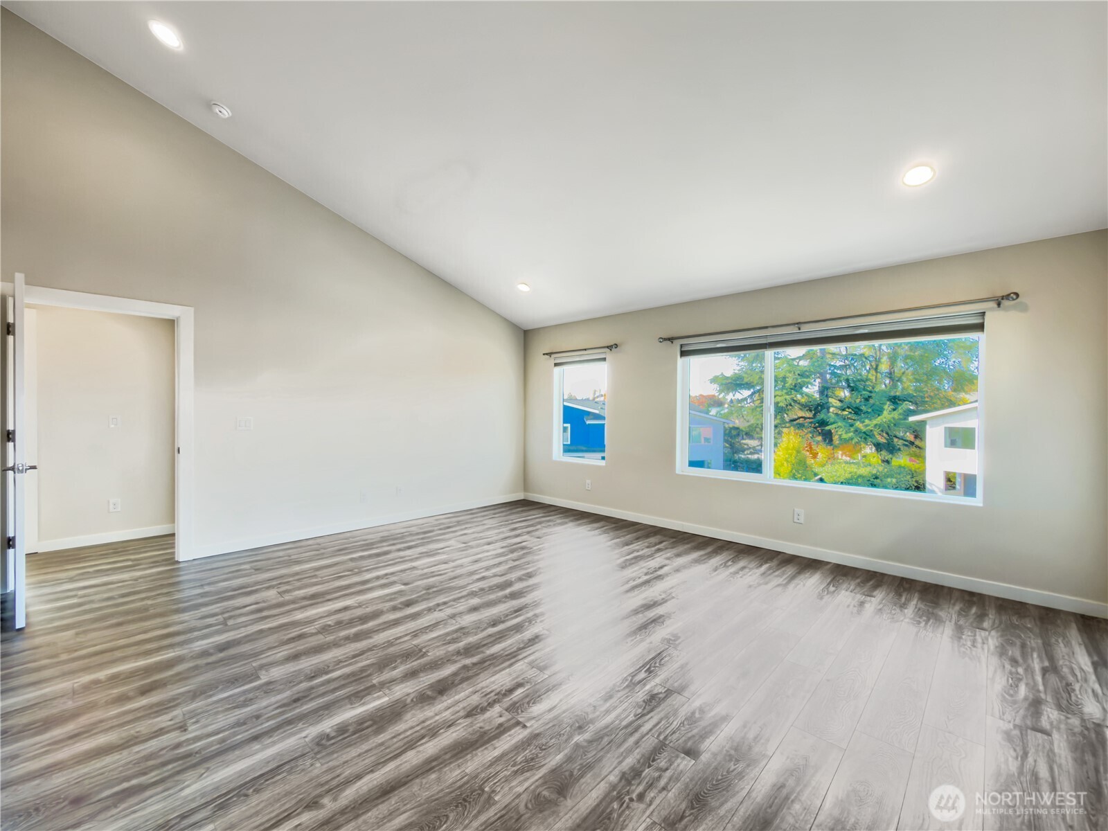 9849 6th Place Southwest Seattle, WA 98106 - Photo 15 of 21 an empty room with wooden floor and windows