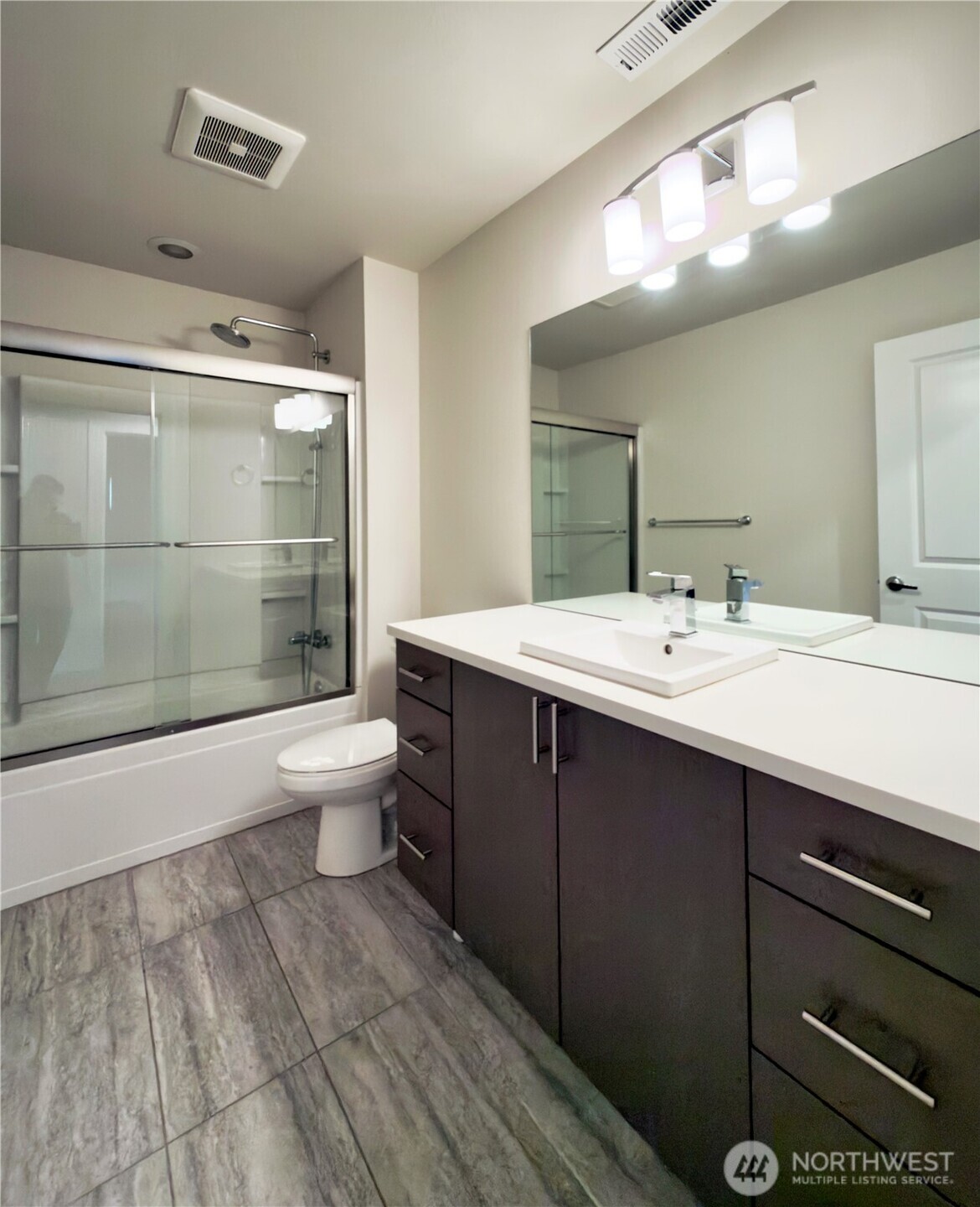 9849 6th Place Southwest Seattle, WA 98106 - Photo 17 of 21 a bathroom with a sink and a mirror