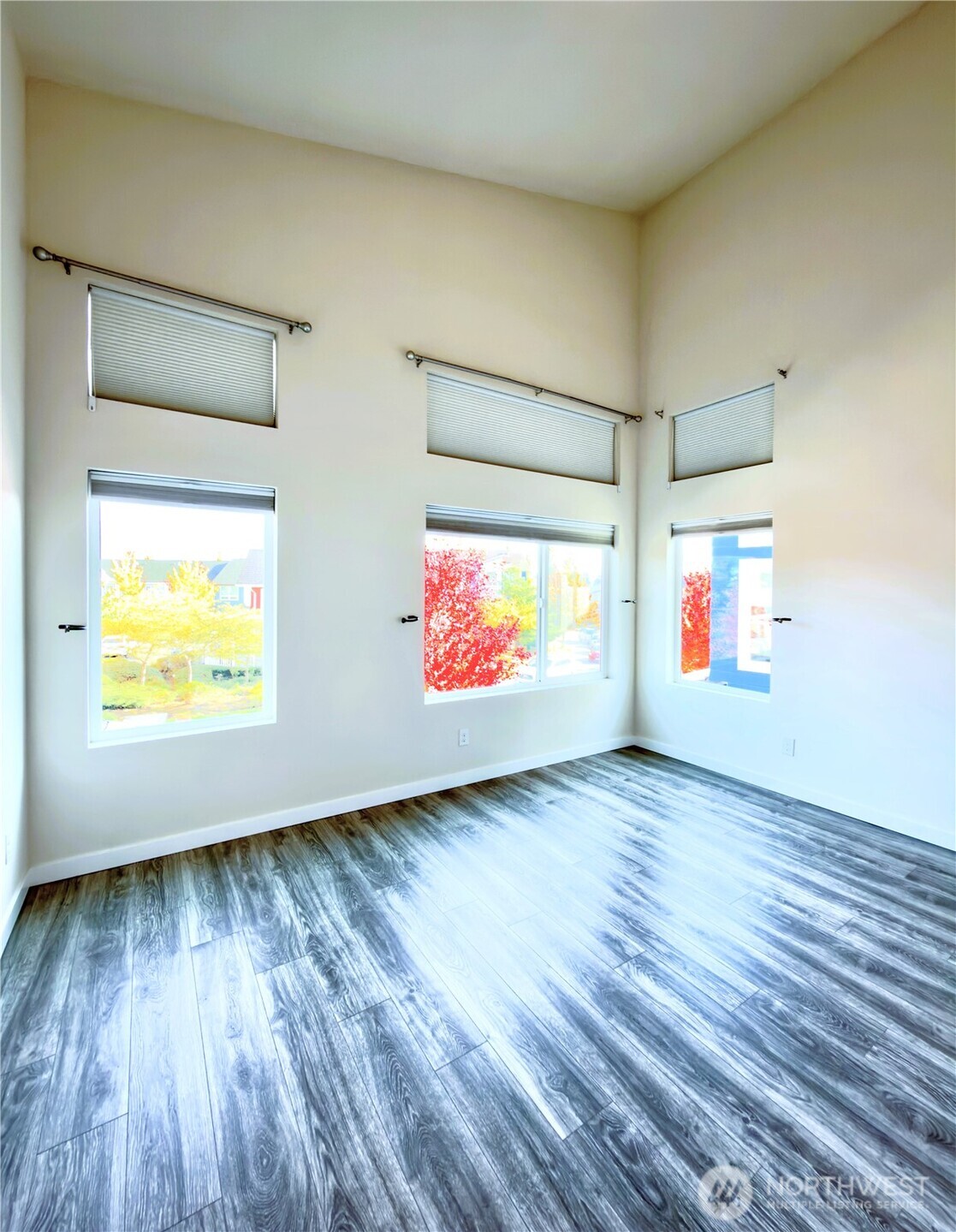 9849 6th Place Southwest Seattle, WA 98106 - Photo 20 of 21 an empty room with wooden floor and windows