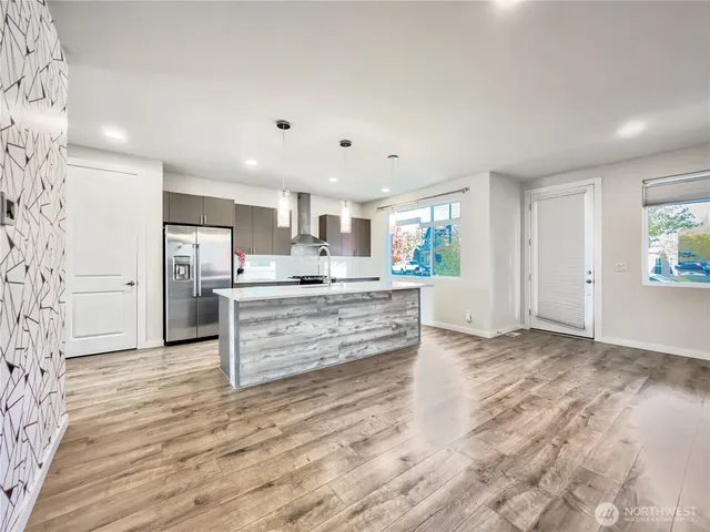 a kitchen with stainless steel appliances a sink and a stove