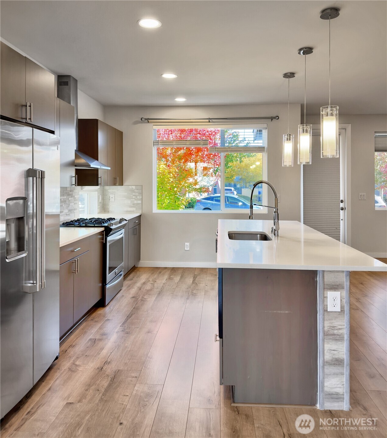 9849 6th Place Southwest Seattle, WA 98106 - Photo 8 of 21 a kitchen with stainless steel appliances a sink and a stove