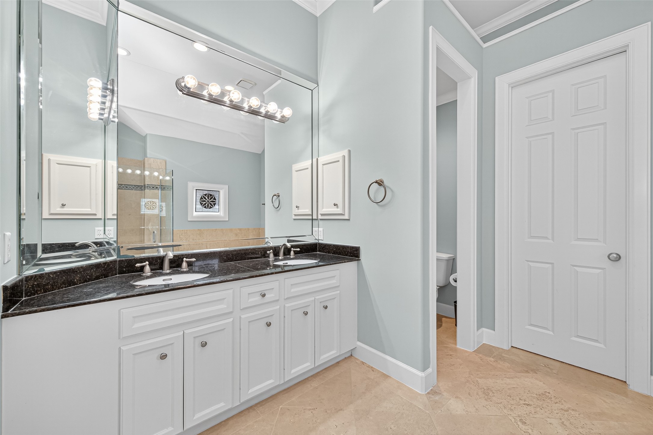 2624 Helena Street Houston, TX 77006 - Photo 20 of 33 a bathroom with a granite countertop sink a mirror and a