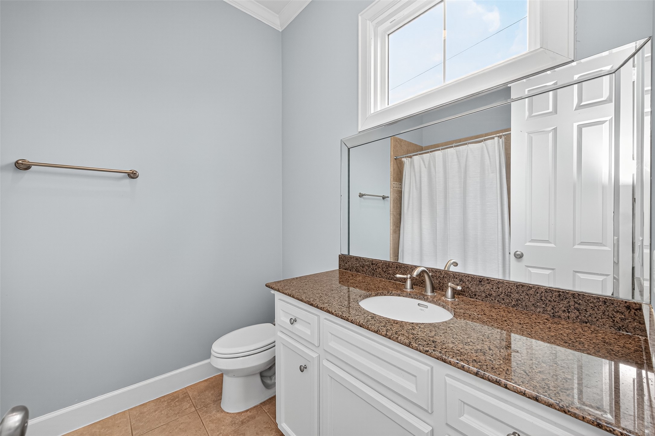 2624 Helena Street Houston, TX 77006 - Photo 24 of 33 a bathroom with a granite countertop sink and a mirror