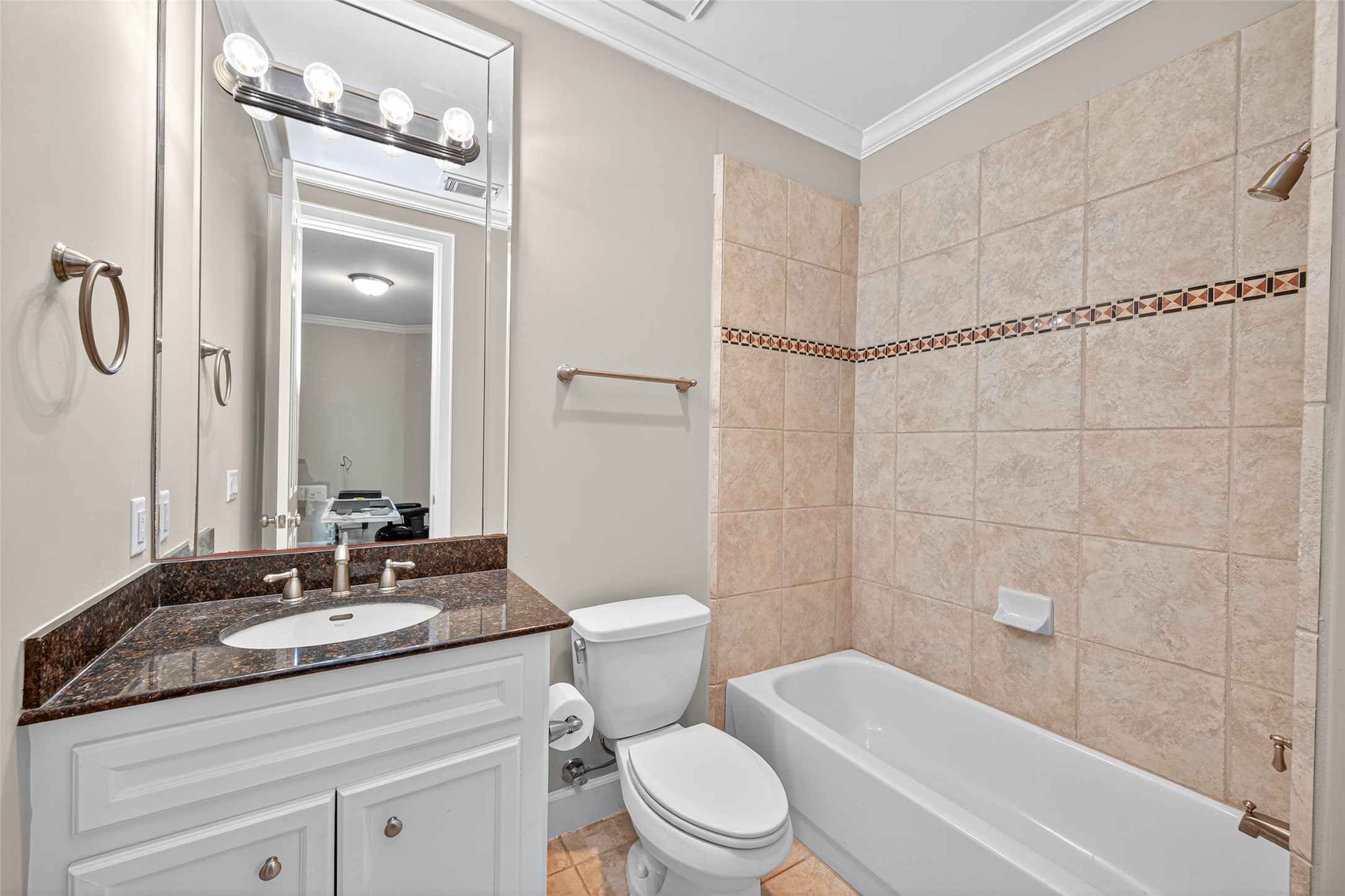 2624 Helena Street Houston, TX 77006 - Photo 6 of 33 a bathroom with a granite countertop sink toilet and shower