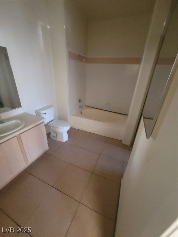 7413 West Russell Road, Unit 107 Las Vegas, NV 89113 - Photo 19 of 48 Full bath with vanity, tile patterned flooring, toilet, and shower combination