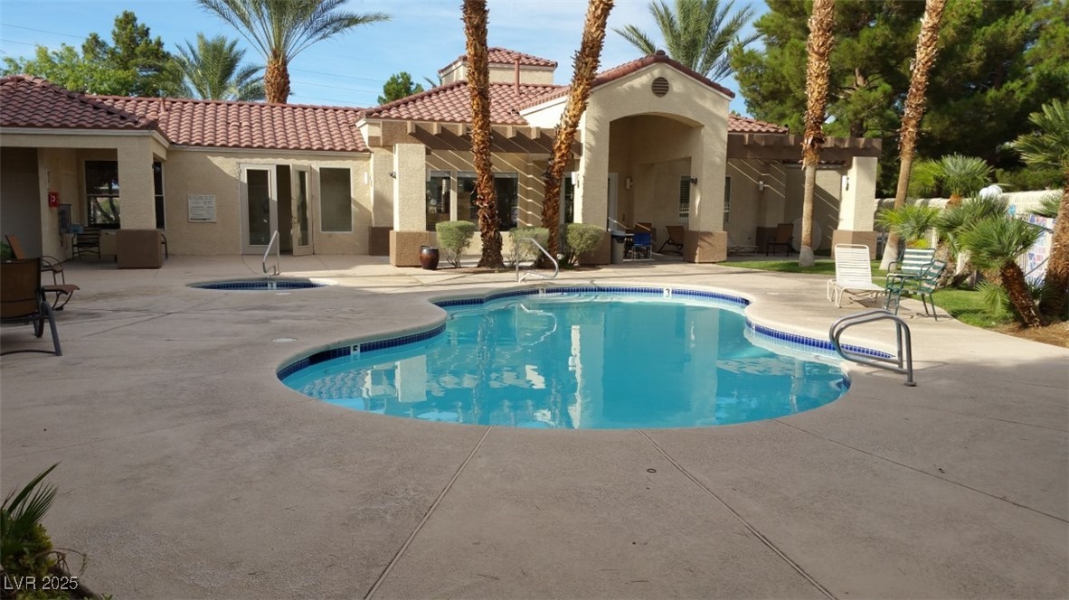7413 West Russell Road, Unit 107 Las Vegas, NV 89113 - Photo 7 of 48 Outdoor pool with a patio