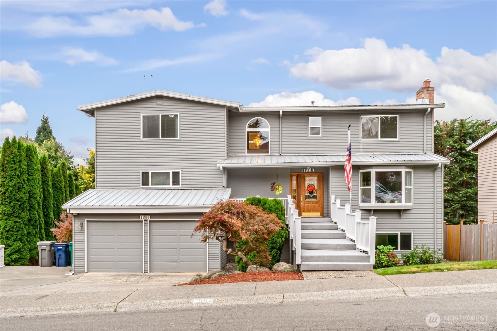 a front view of a house with a garage