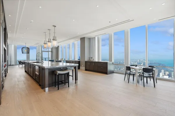 a view of a dining room with furniture window and outside view