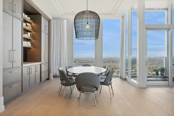 a view of a dining room with furniture window and outside view