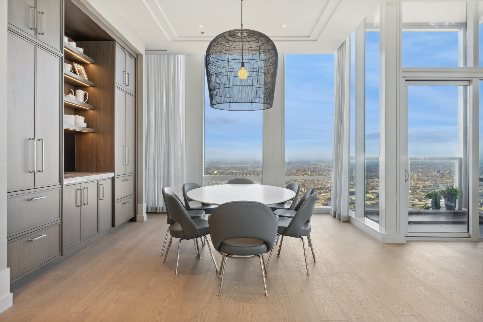 14 West Superior Street, Unit 7100 Chicago, IL 60654 - Photo 15 of 50 a view of a dining room with furniture window and outside view