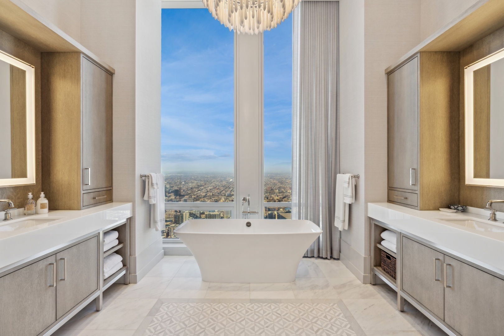 14 West Superior Street, Unit 7100 Chicago, IL 60654 - Photo 22 of 50 a spacious bathroom with a double vanity sink a mirror and a bathtub