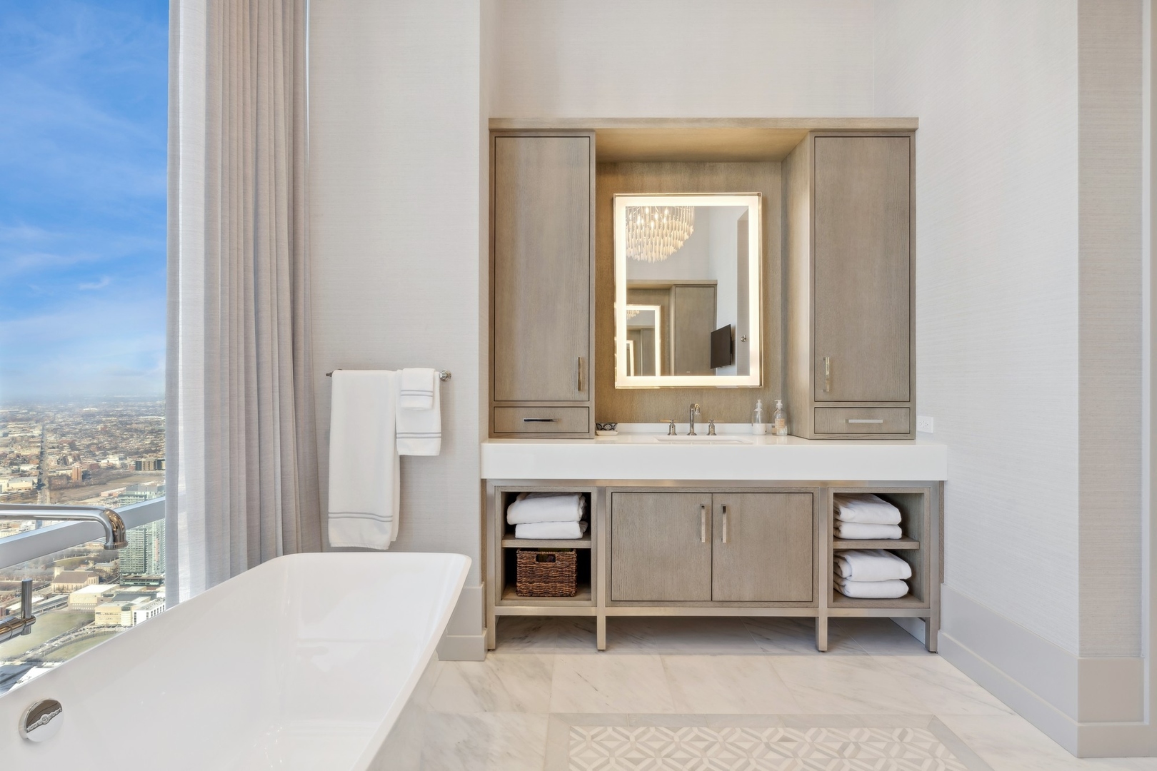 14 West Superior Street, Unit 7100 Chicago, IL 60654 - Photo 23 of 50 a en suite bathroom with a granite countertop sink and a mirror