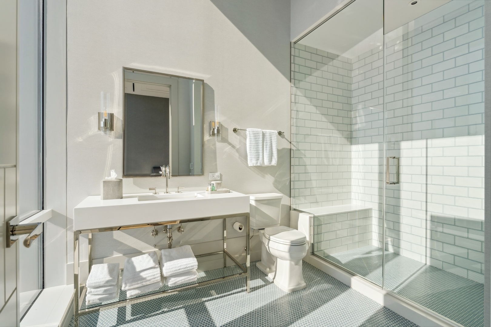 14 West Superior Street, Unit 7100 Chicago, IL 60654 - Photo 26 of 50 a bathroom with a sink mirror and a toilet