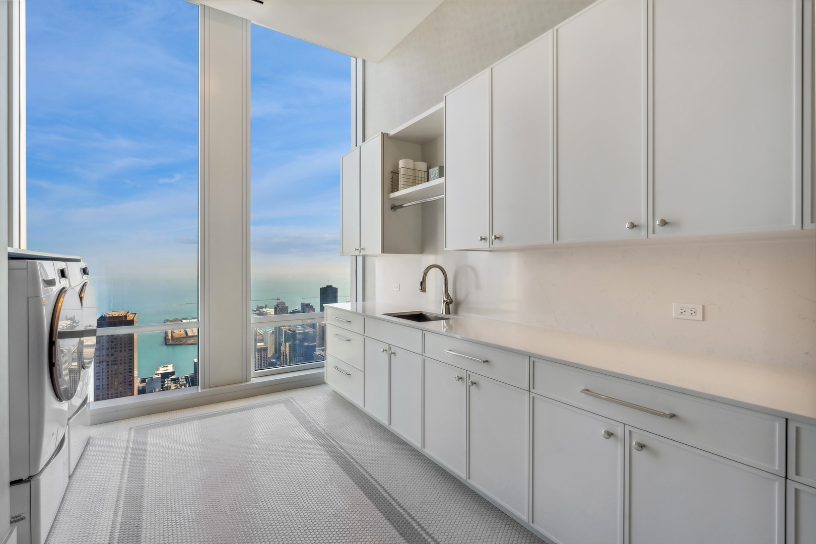 14 West Superior Street, Unit 7100 Chicago, IL 60654 - Photo 28 of 50 a kitchen with a sink and cabinets