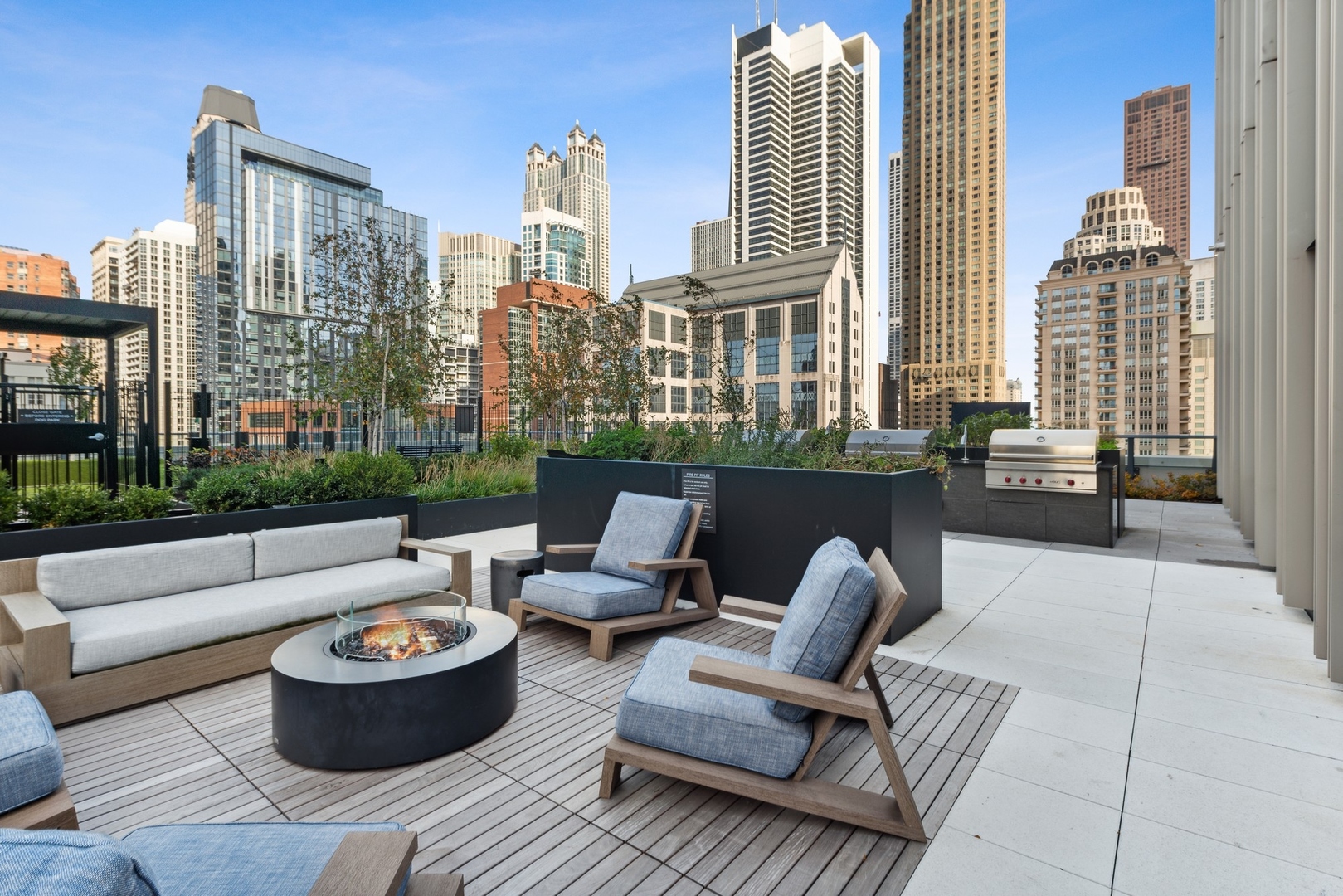 14 West Superior Street, Unit 7100 Chicago, IL 60654 - Photo 44 of 50 a view of a patio with couches and a potted plant on a table