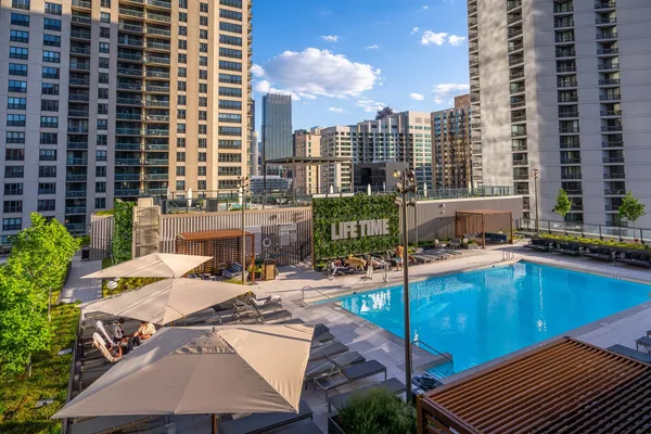 a view of a swimming pool with chairs