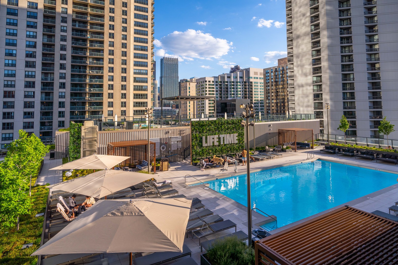14 West Superior Street, Unit 7100 Chicago, IL 60654 - Photo 49 of 50 a view of a swimming pool with chairs