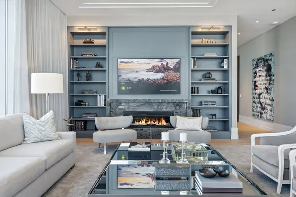 a living room with furniture and a fireplace
