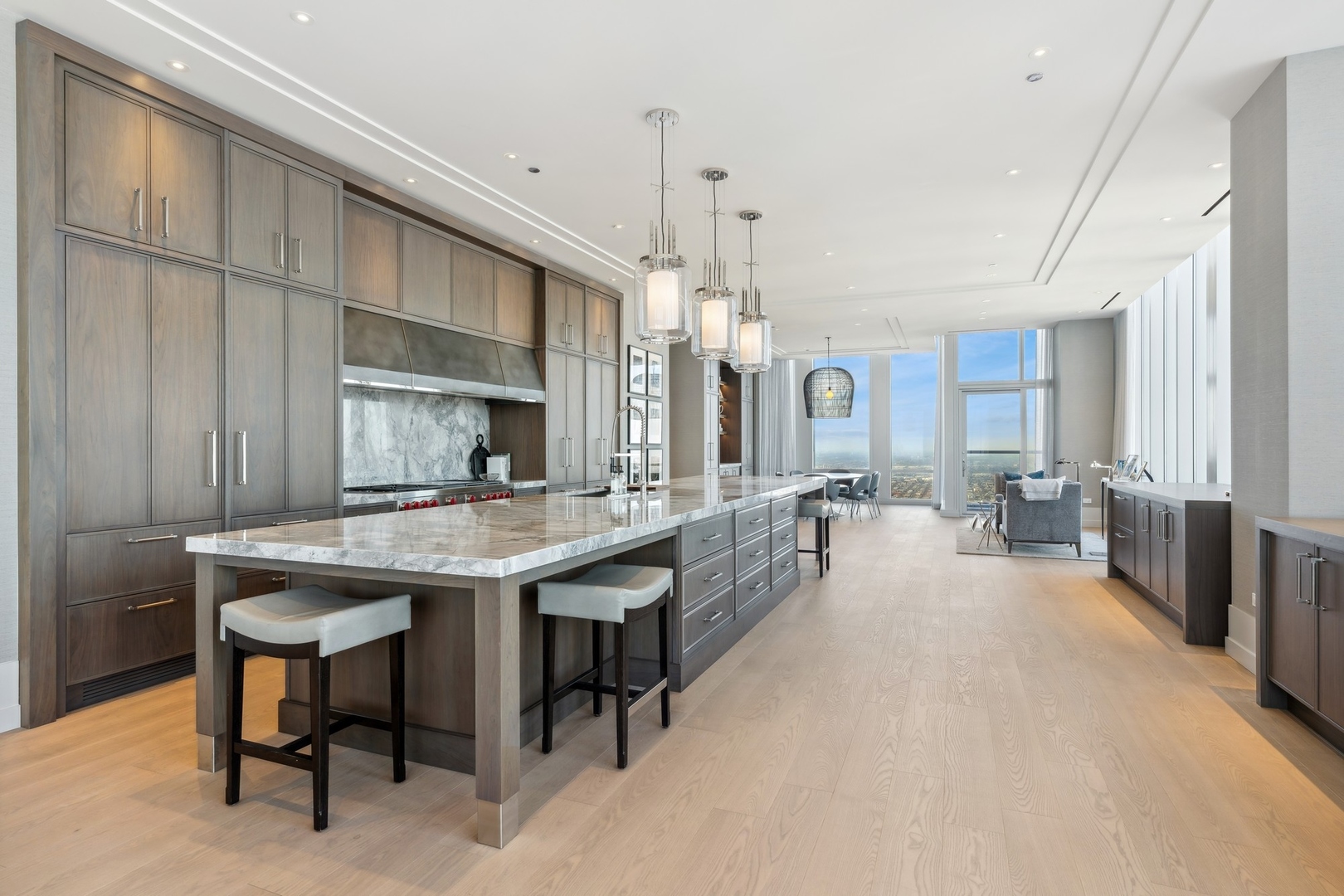 14 West Superior Street, Unit 7100 Chicago, IL 60654 - Photo 8 of 50 a large kitchen with a table and chairs