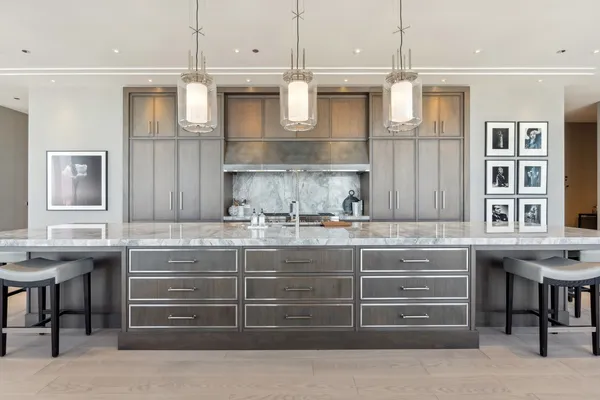 a kitchen with a sink and a refrigerator
