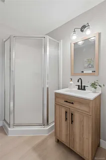 a bathroom with a double vanity sink and mirror