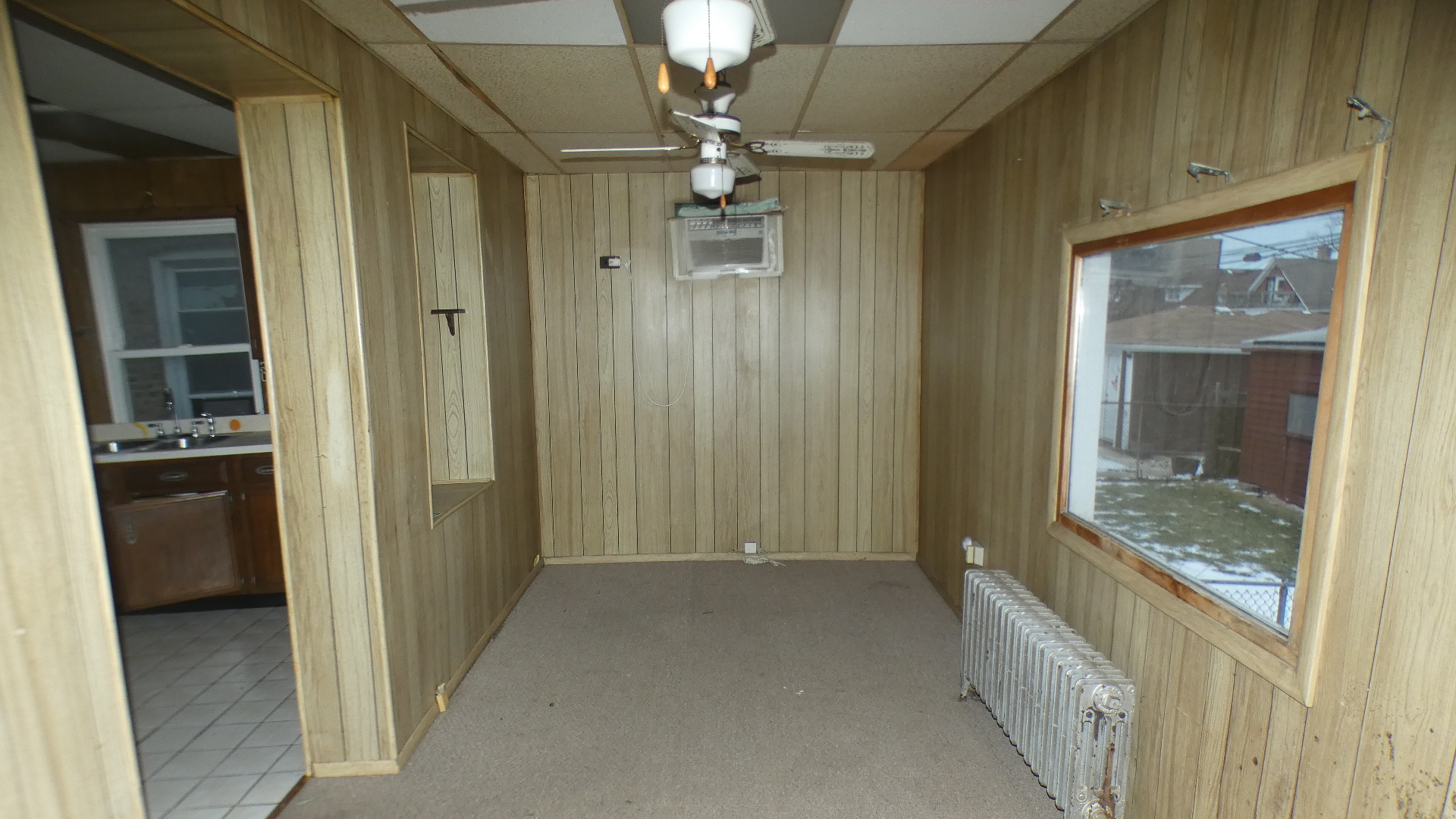 8133 South Loomis Boulevard Chicago, IL 60620 - Photo 16 of 32 a view of a hallway with a chandelier