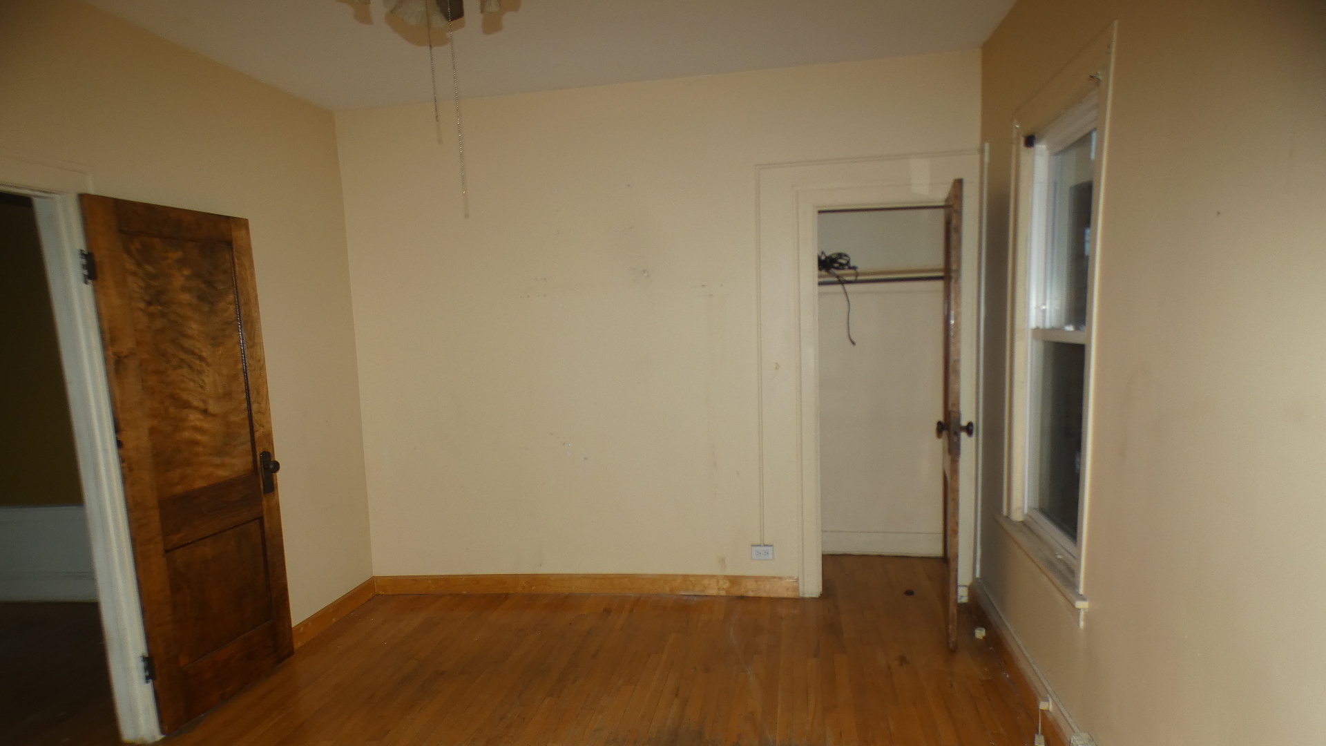 8133 South Loomis Boulevard Chicago, IL 60620 - Photo 20 of 32 an empty room with wooden floor and closet