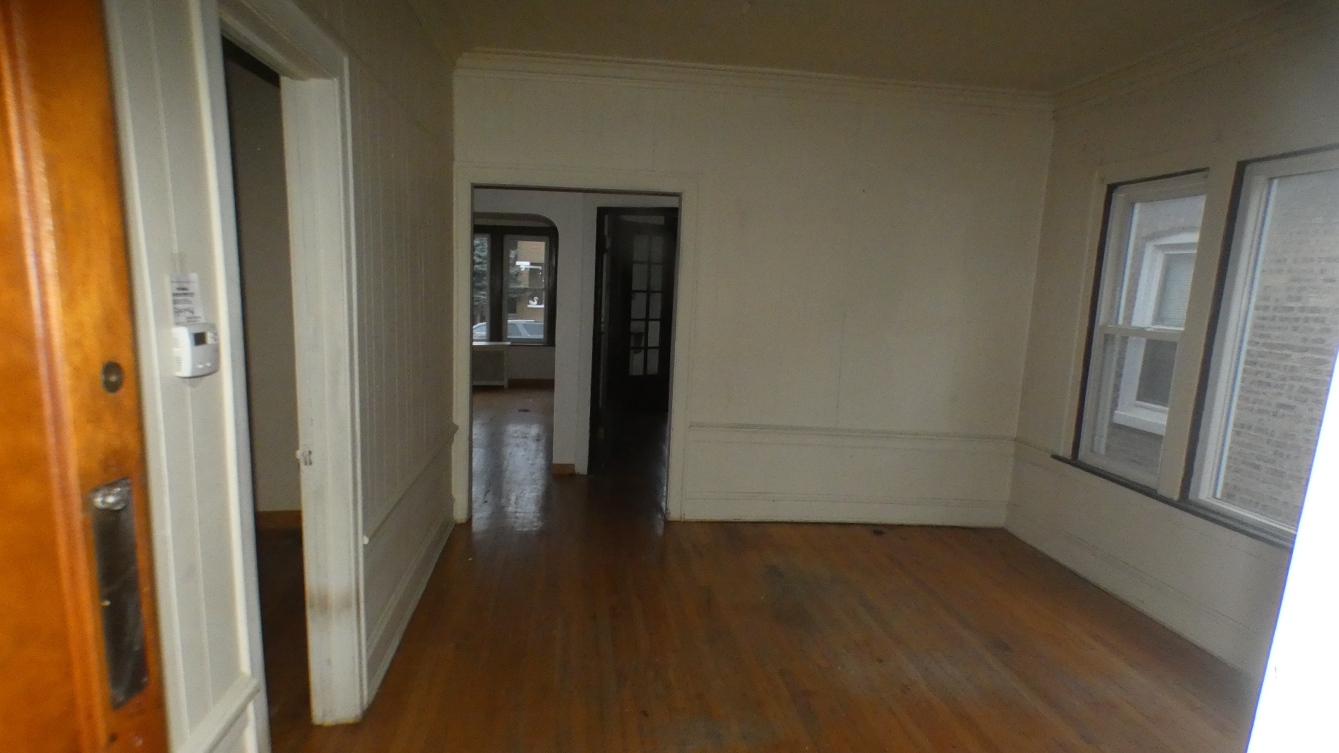 8133 South Loomis Boulevard Chicago, IL 60620 - Photo 21 of 32 a view of a small space with wooden floor and a window