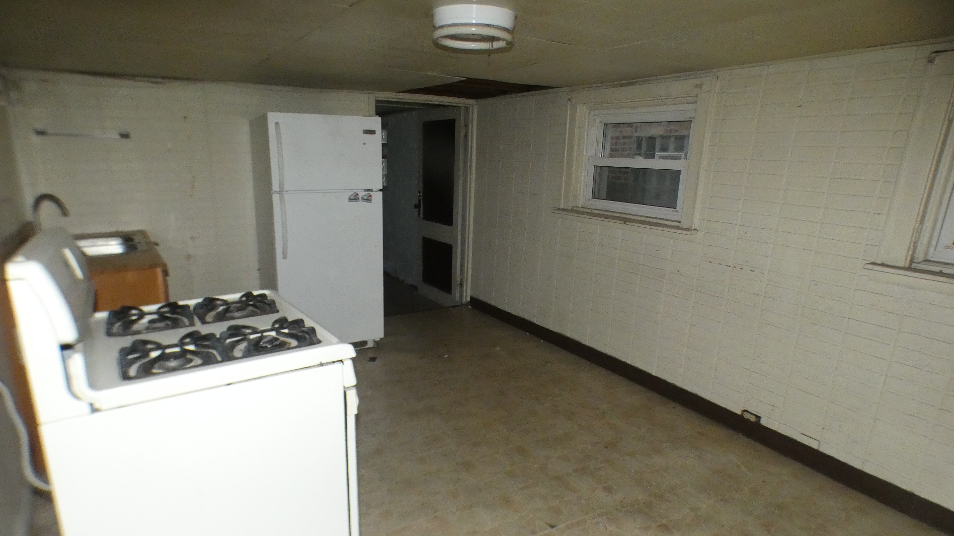 8133 South Loomis Boulevard Chicago, IL 60620 - Photo 26 of 32 a kitchen with a stove and a refrigerator