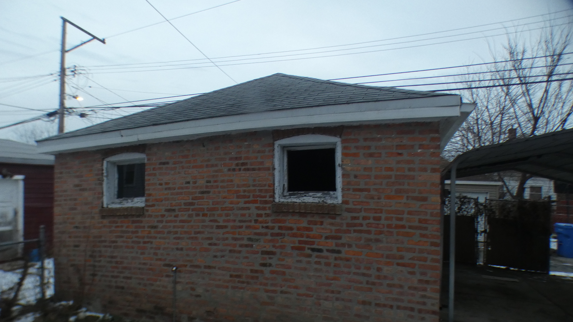 8133 South Loomis Boulevard Chicago, IL 60620 - Photo 31 of 32 a brick building with a large windows